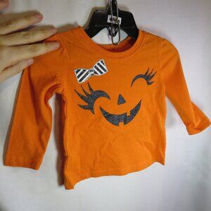 Baby smiling girl Jack O' Lantern face shirt with glitter accents costume